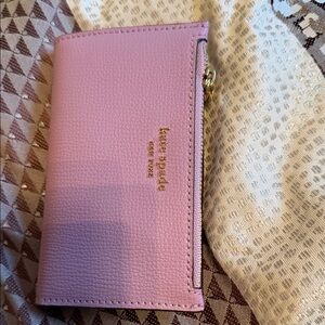 kate spade pink pebbled leather zip wallet with gold logo